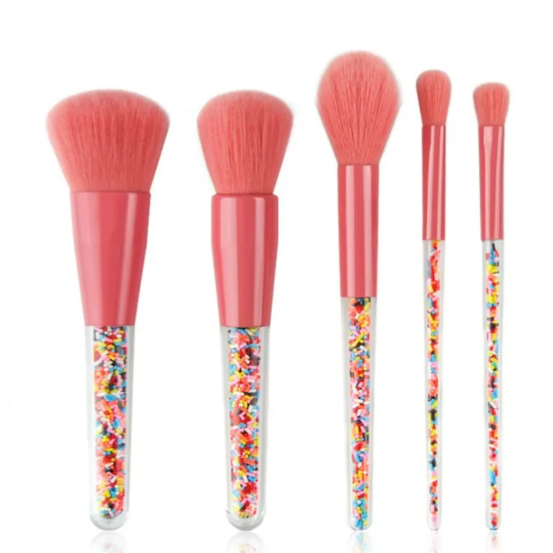 5 candy makeup brushes with colourful acrylic handles, fibre hair bristles, and aluminium ferrules on a white background