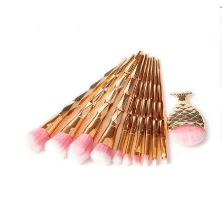 12 piece makeup brush set with nylon bristles, plastic long rod handles, mermaid and diamond design in rose gold
