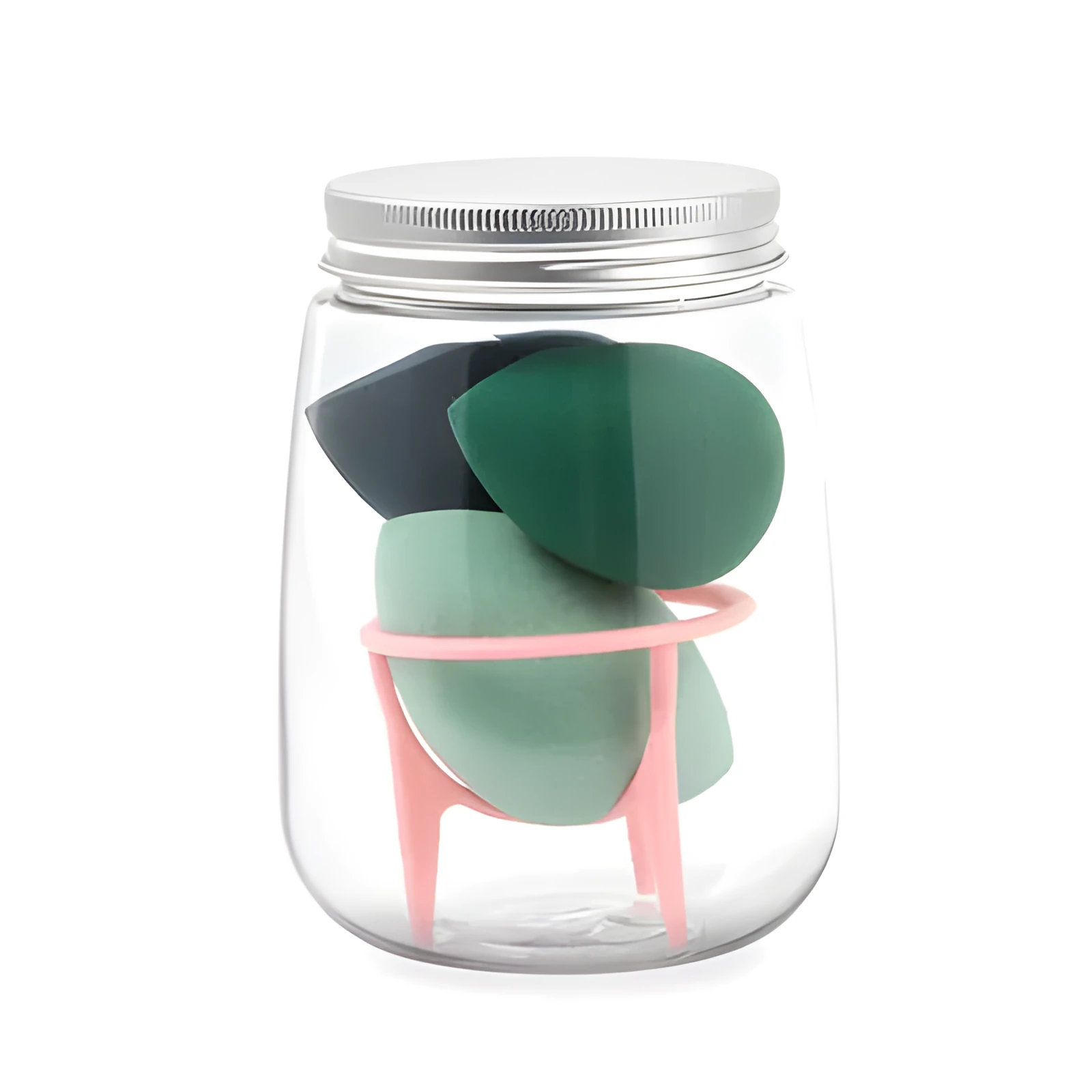 Three cosmetic sponges in different shapes placed on a holder next to a clear jar containing additional sponges.
