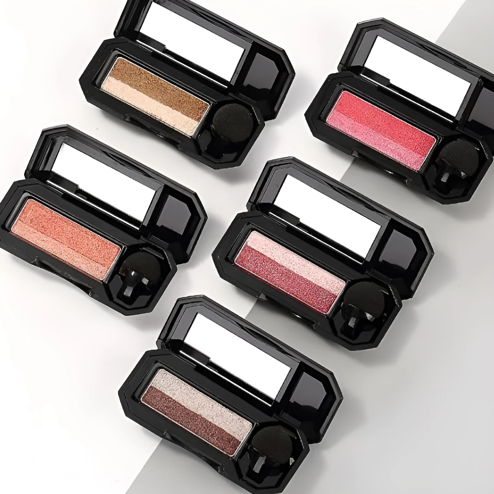 Dual-color pressed powder eyeshadow palette in a compact case, six style options available