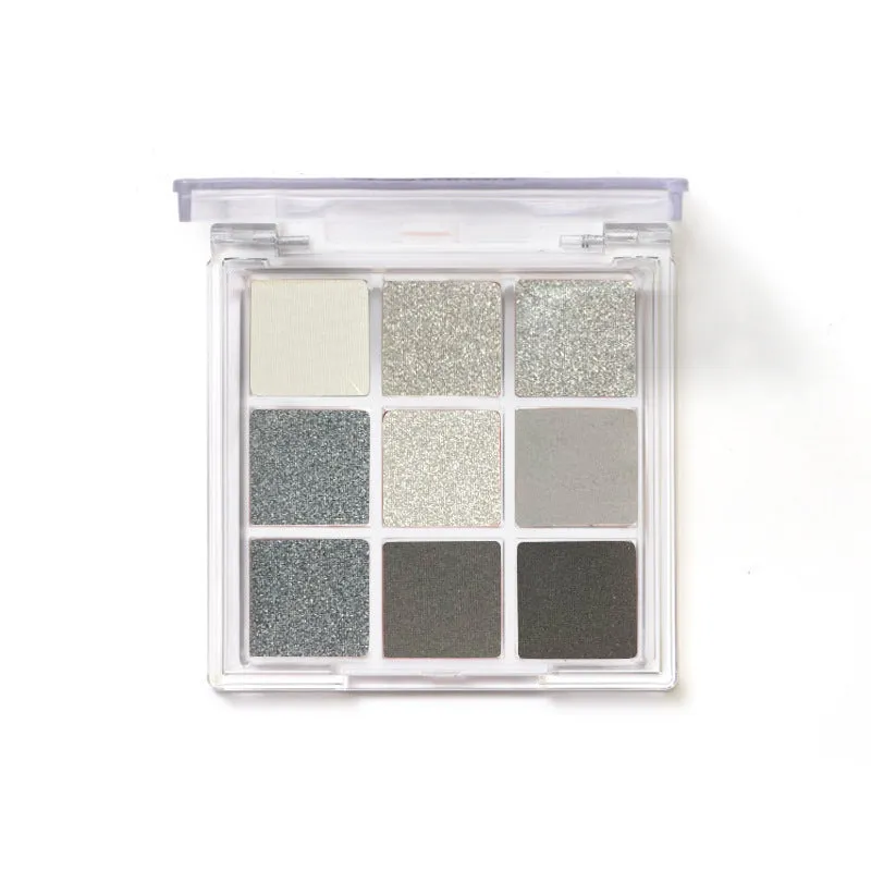 Smoked nine-colour eye shadow palette showing white, silver, black, and iron grey shades