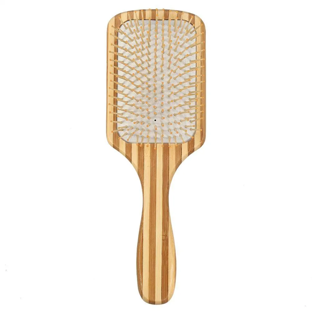 Natural bamboo scalp massage comb with round nylon teeth and rubber pad on neutral background