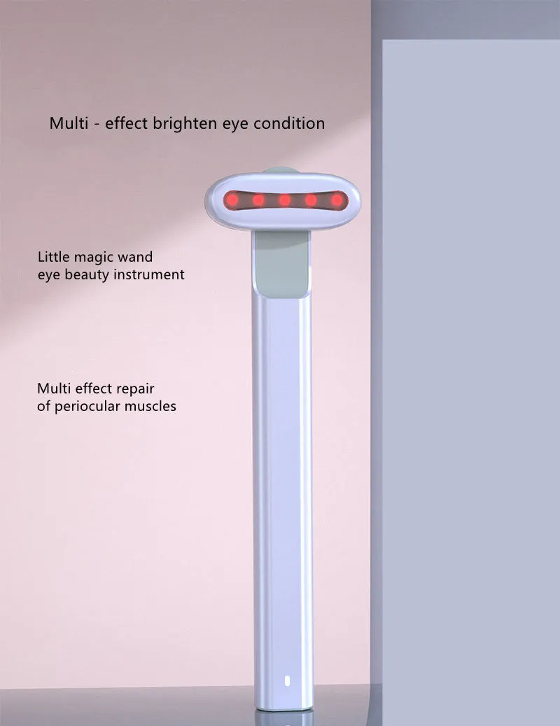 Micro current introduction eye massage instrument in green, with RF gear and USB charging cable on a white background
