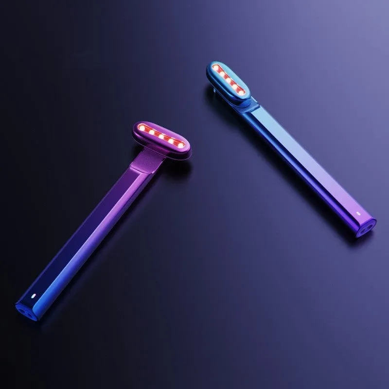 Micro current introduction eye massage instrument in green, with RF gear and USB charging cable on a white background