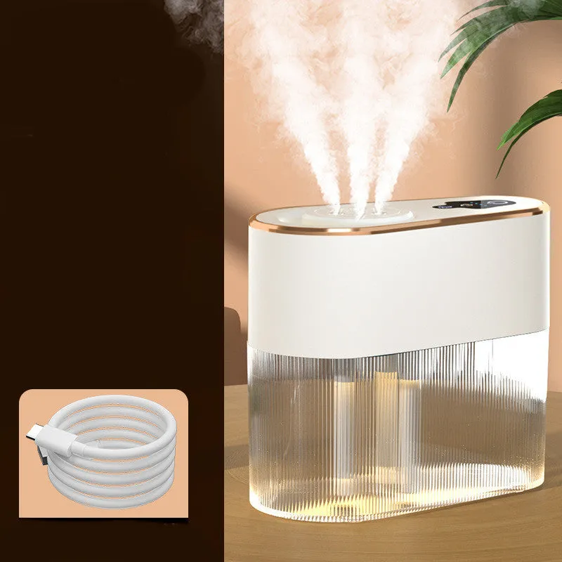 Electric three jet humidifier in blue with USB cable, 1.0-2.5L tank, and atmosphere lamp on a bedroom desktop
