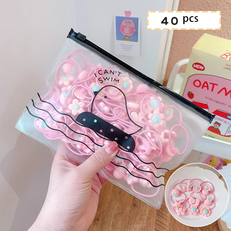 Children's elastic hair loops in pink with flower pattern on white background