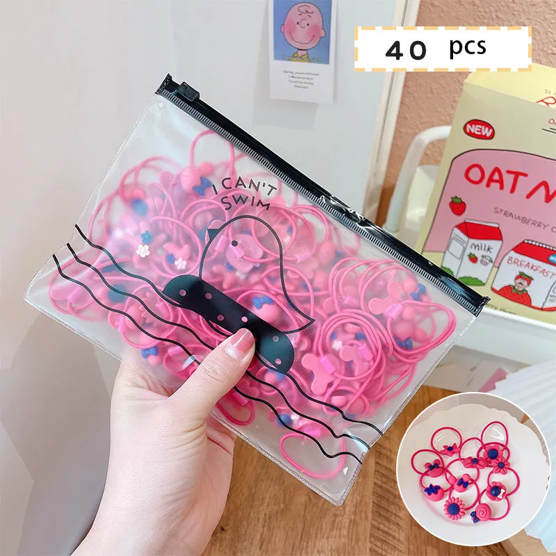 Children's elastic hair loops in pink with flower pattern on white background