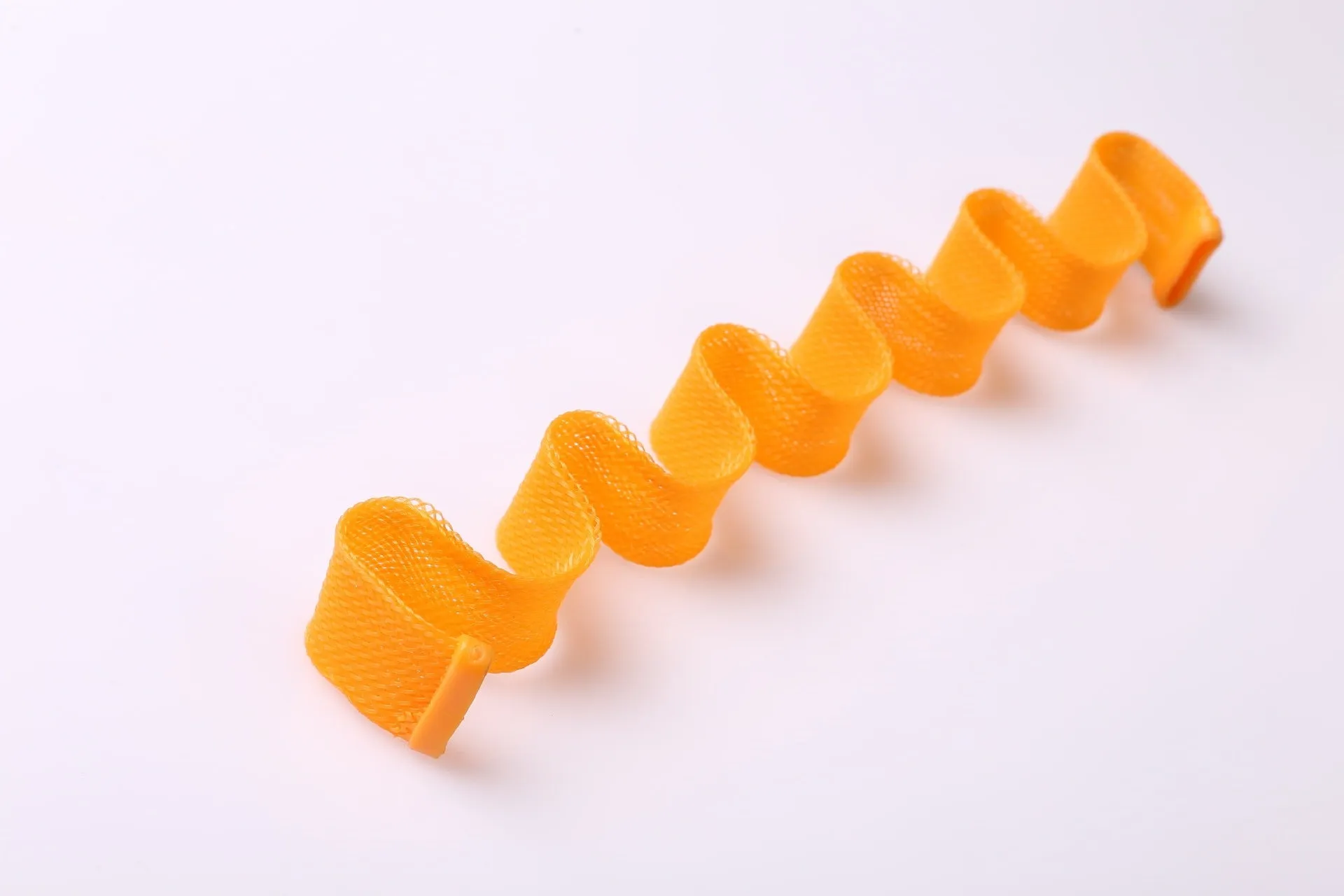 Twelve manual hair curlers in blue orange on a flat surface, 30cm length per curler
