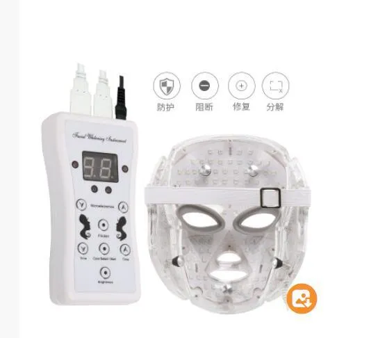 White LED light therapy face mask with opaque eye protection, remote control, and neck care section on a flat surface