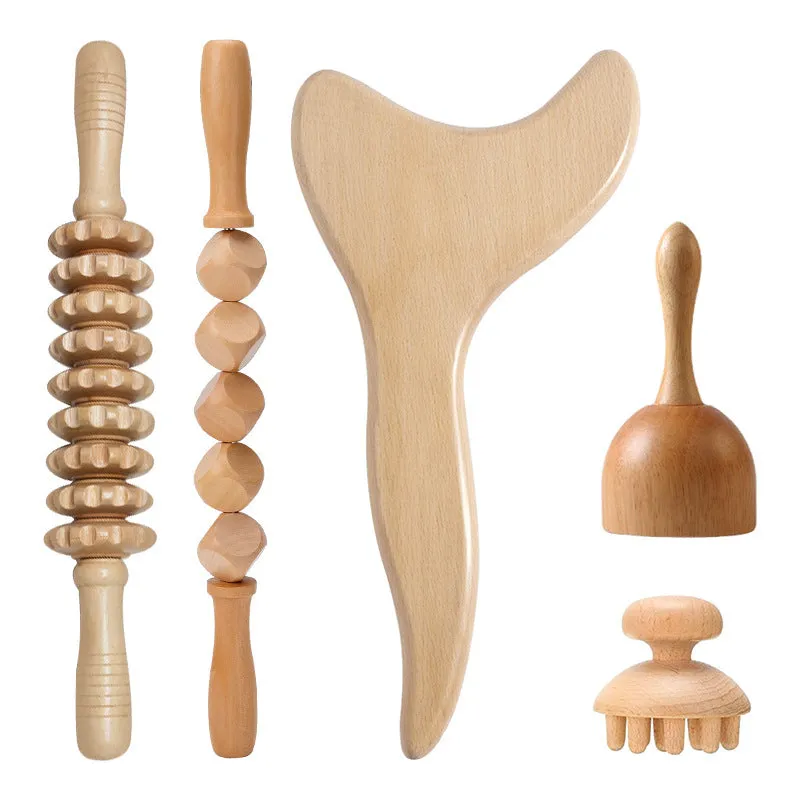 Set of three birch wood anti-cellulite massage hand rollers on a white background