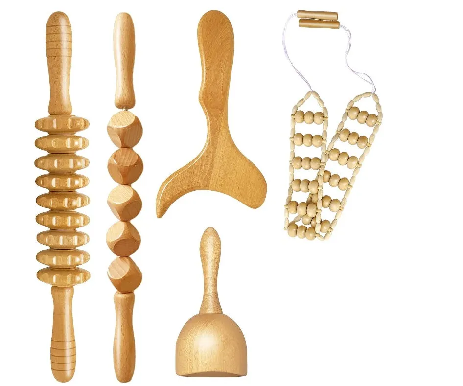 Set of three birch wood anti-cellulite massage hand rollers on a white background