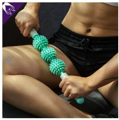 Anti cellulite massager stick with hedgehog-shaped balls and green padded ergonomic handles on a white background