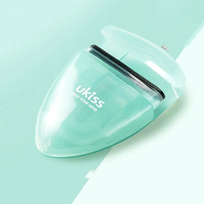 Mini portable eyelash curler in white with silicone pad and stainless steel arm