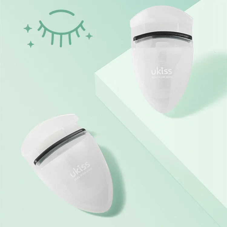 Mini portable eyelash curler in white with silicone pad and stainless steel arm