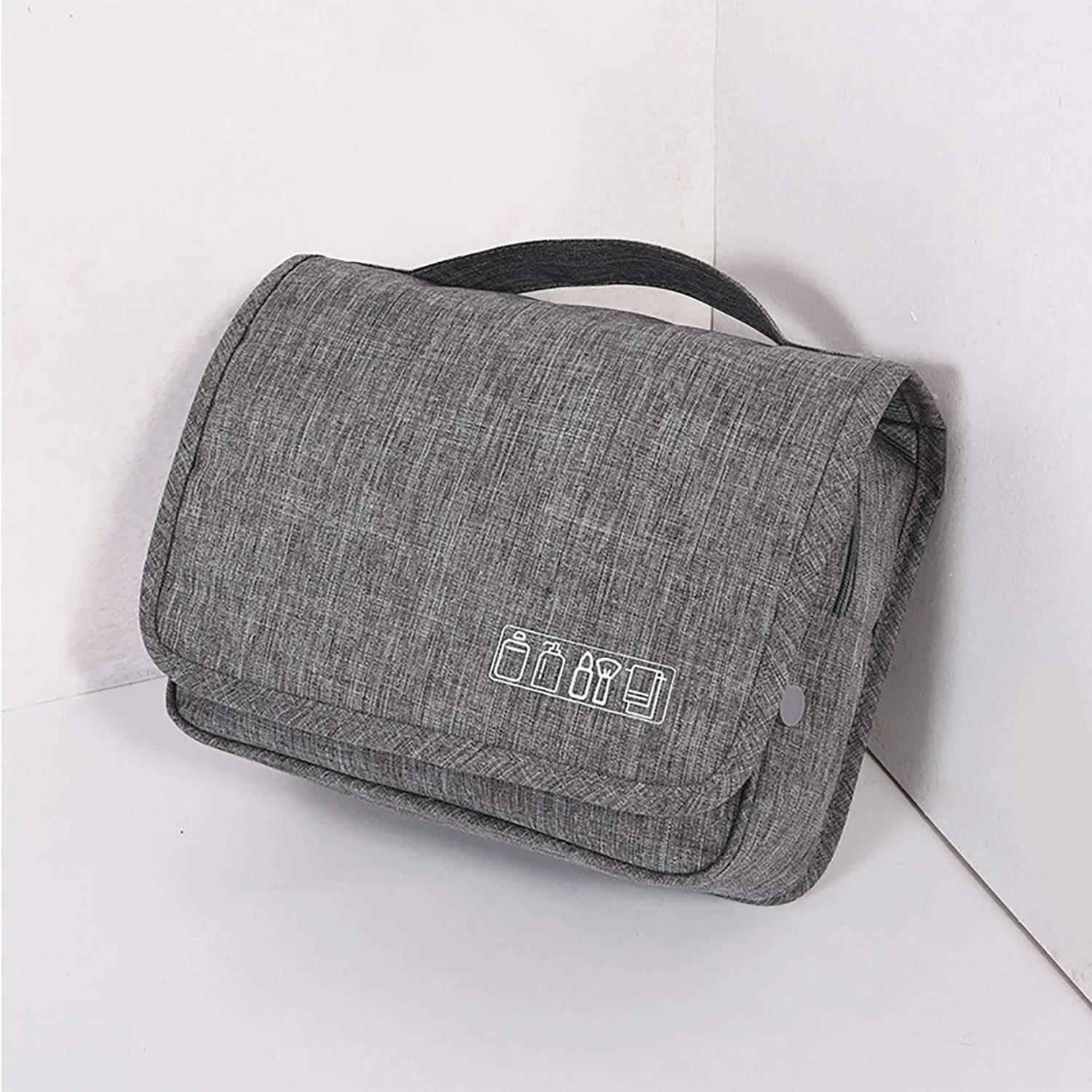 Large waterproof hanging toiletry bag in black with four compartments and metal hook