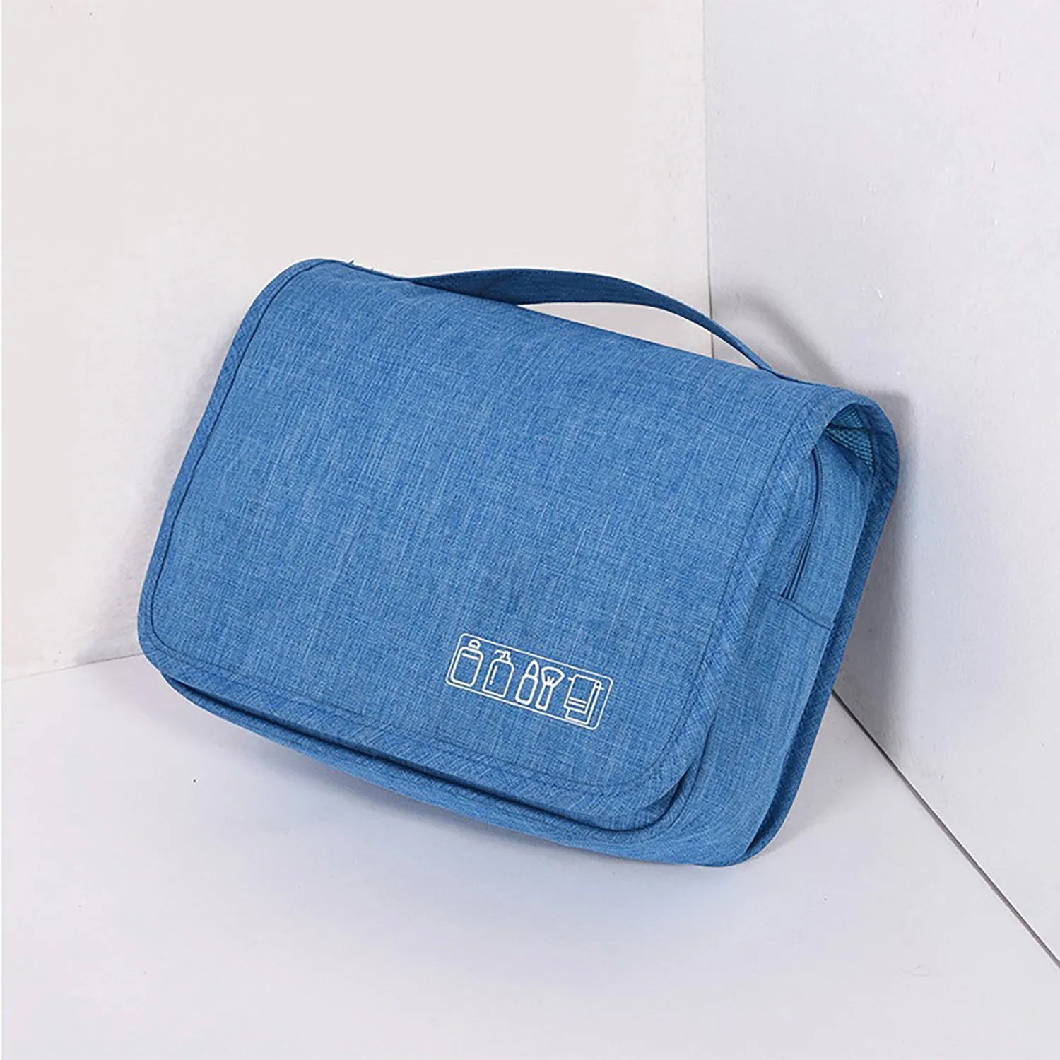 Large waterproof hanging toiletry bag in black with four compartments and metal hook