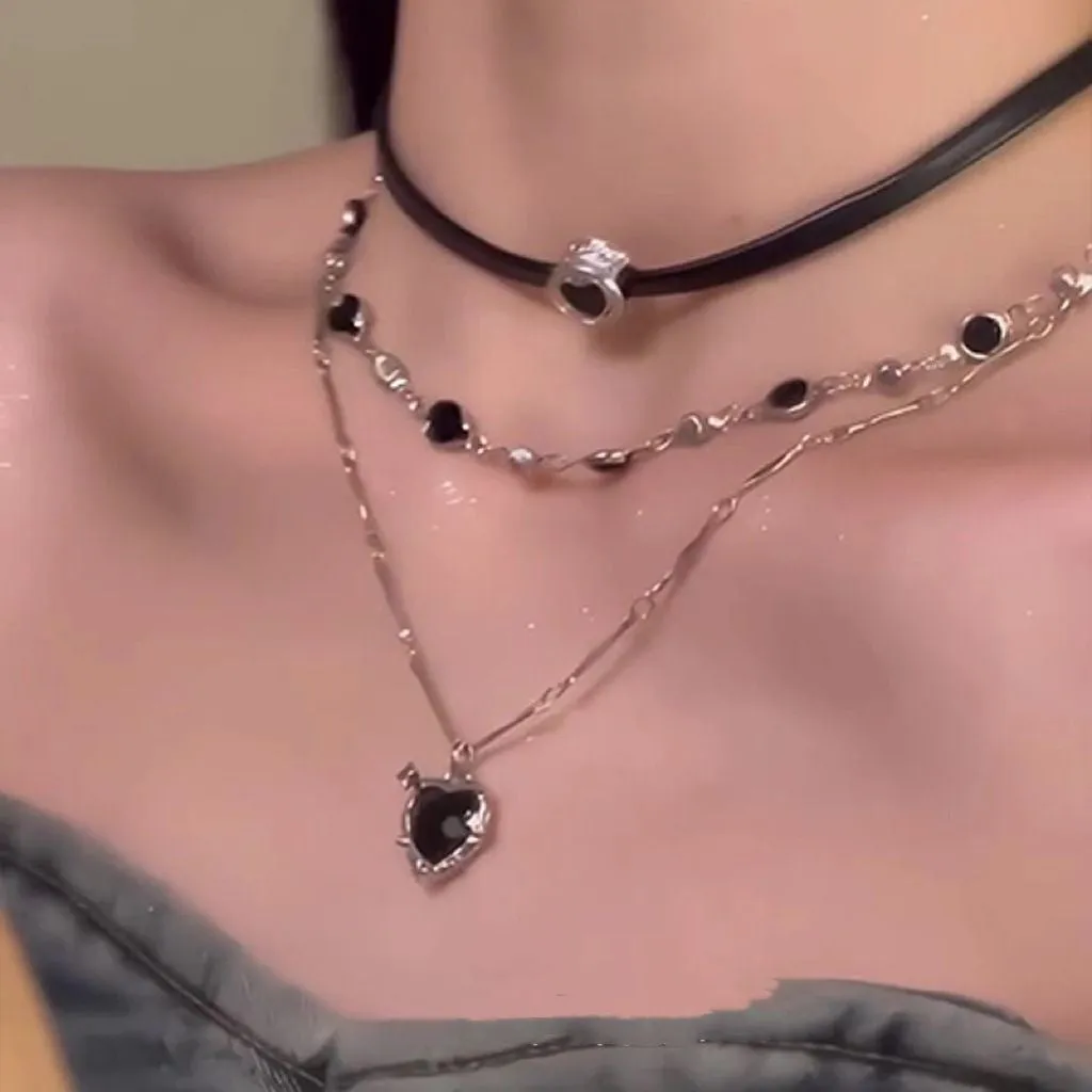 Women's multi-layer heart necklace set with alloy pendant, artificial crystal, and leather accents on an adjustable clavicle chain.
