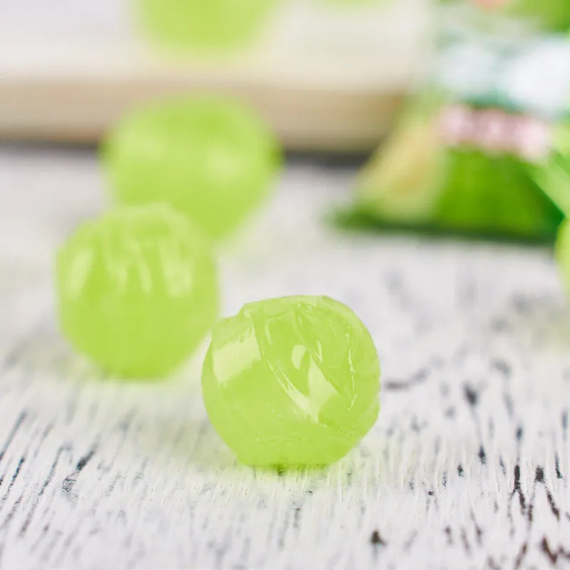 Assortment of Chinese fruit hard candies: plum sugar, guava and tangerine peel flavours in separate packets.