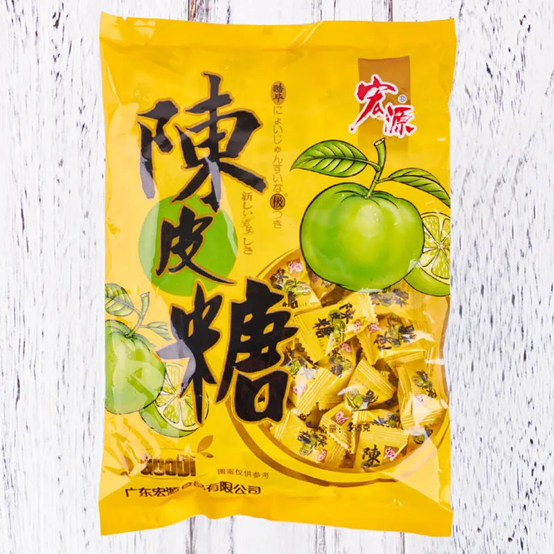 Assortment of Chinese fruit hard candies: plum sugar, guava and tangerine peel flavours in separate packets.