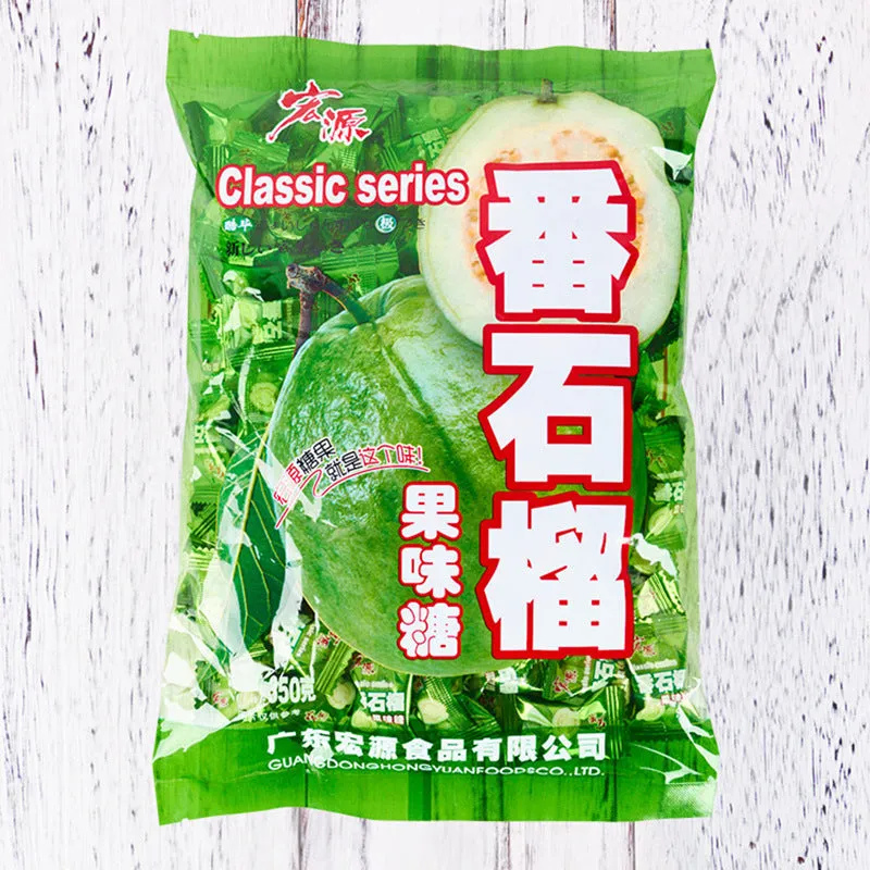 Assortment of Chinese fruit hard candies: plum sugar, guava and tangerine peel flavours in separate packets.