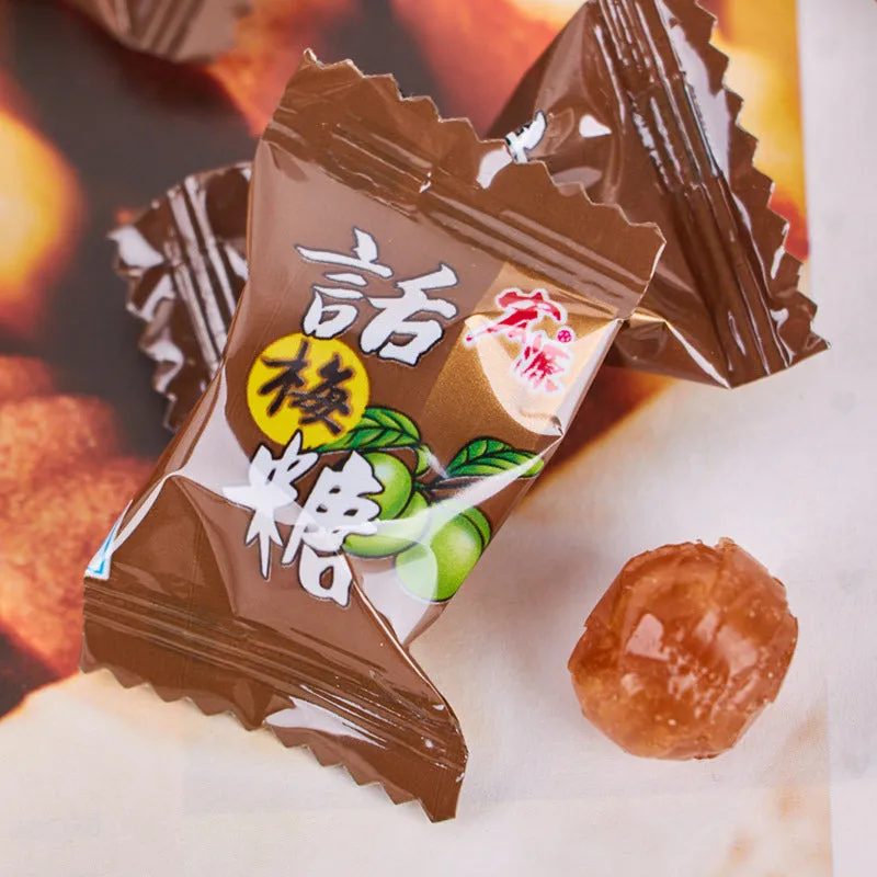 Assortment of Chinese fruit hard candies: plum sugar, guava and tangerine peel flavours in separate packets.