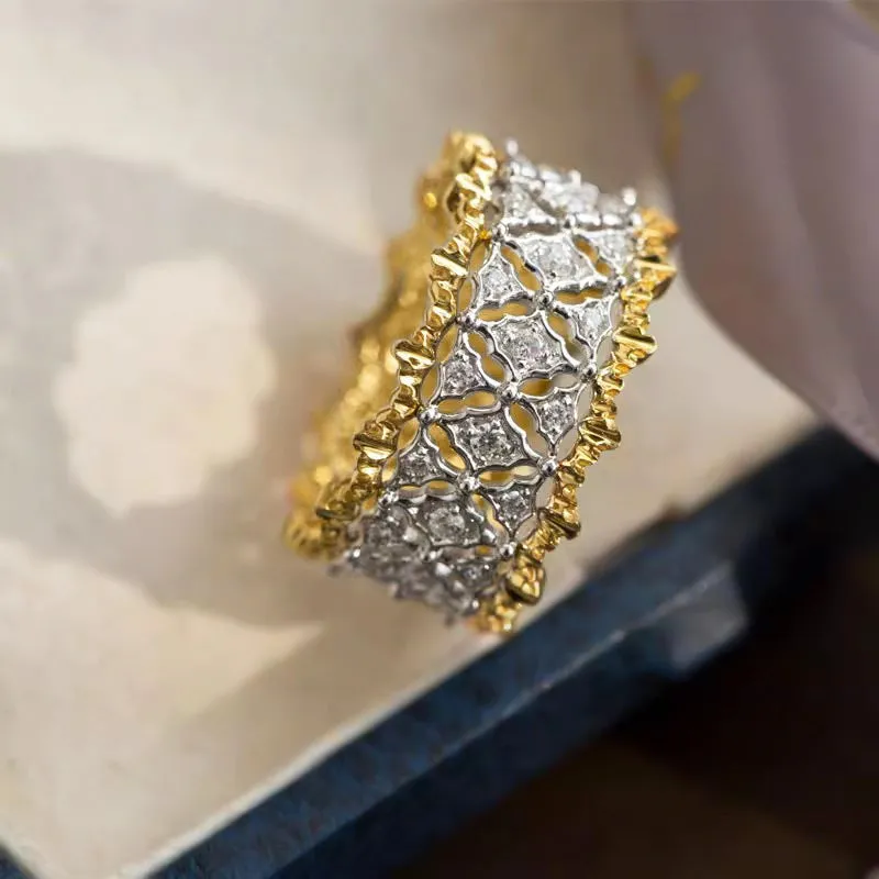 Geometric round two-tone zircon ring on a copper band, showing electroplated finish.