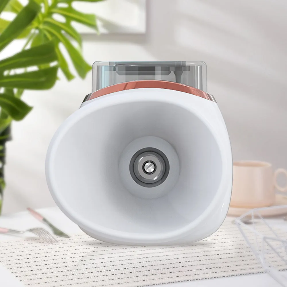 White and purple personal eye humidifier device with USB charging cable on a table.
