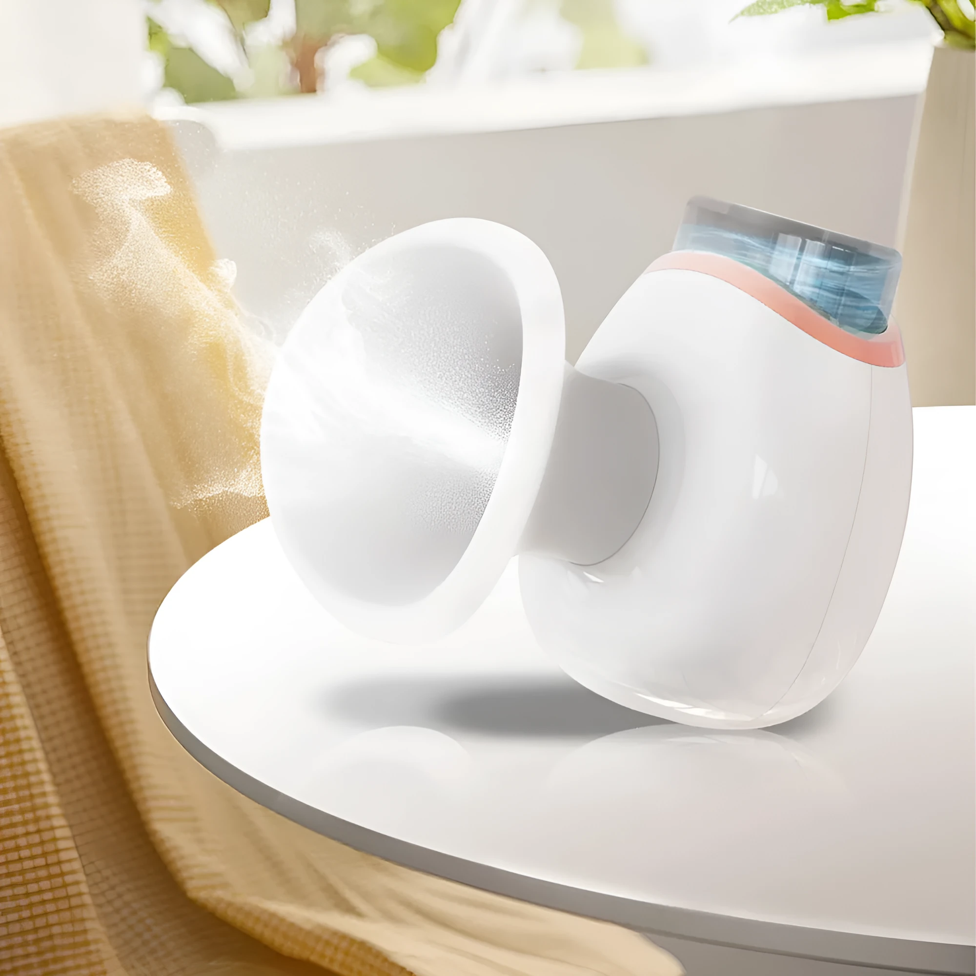 White and purple personal eye humidifier device with USB charging cable on a table.
