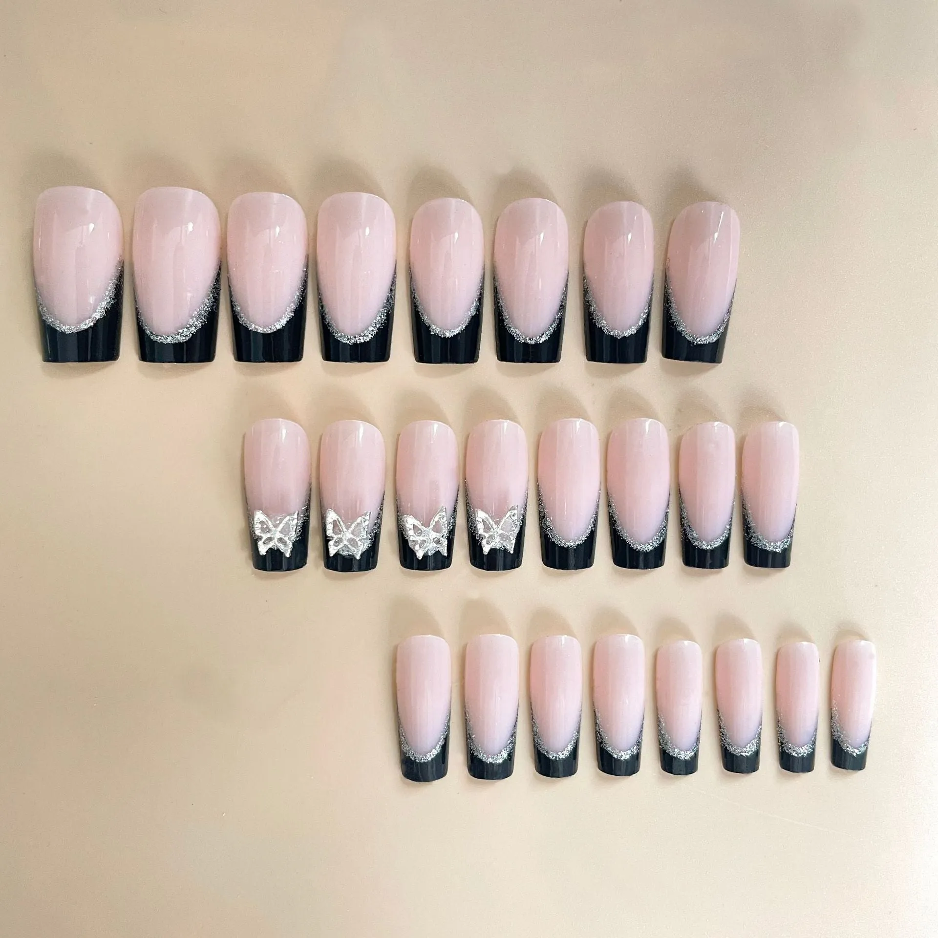 Black French style nail wear armor with glittering butterfly pattern, shown in yellow and black jelly glue colour options.