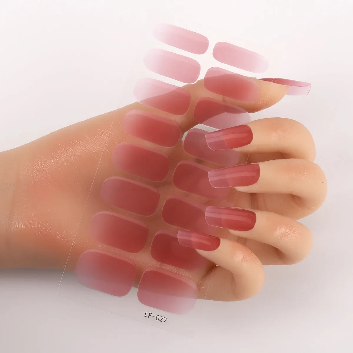 Pack of solid colour nail art stickers showing 16 different small designs including flowers, animals, and geometric patterns.