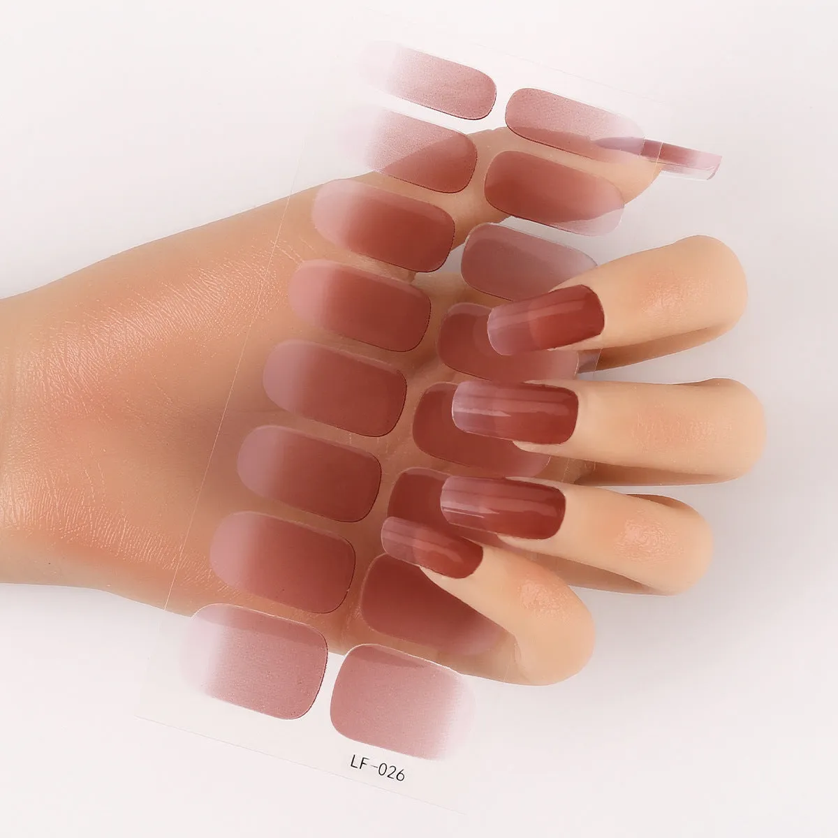Pack of solid colour nail art stickers showing 16 different small designs including flowers, animals, and geometric patterns.