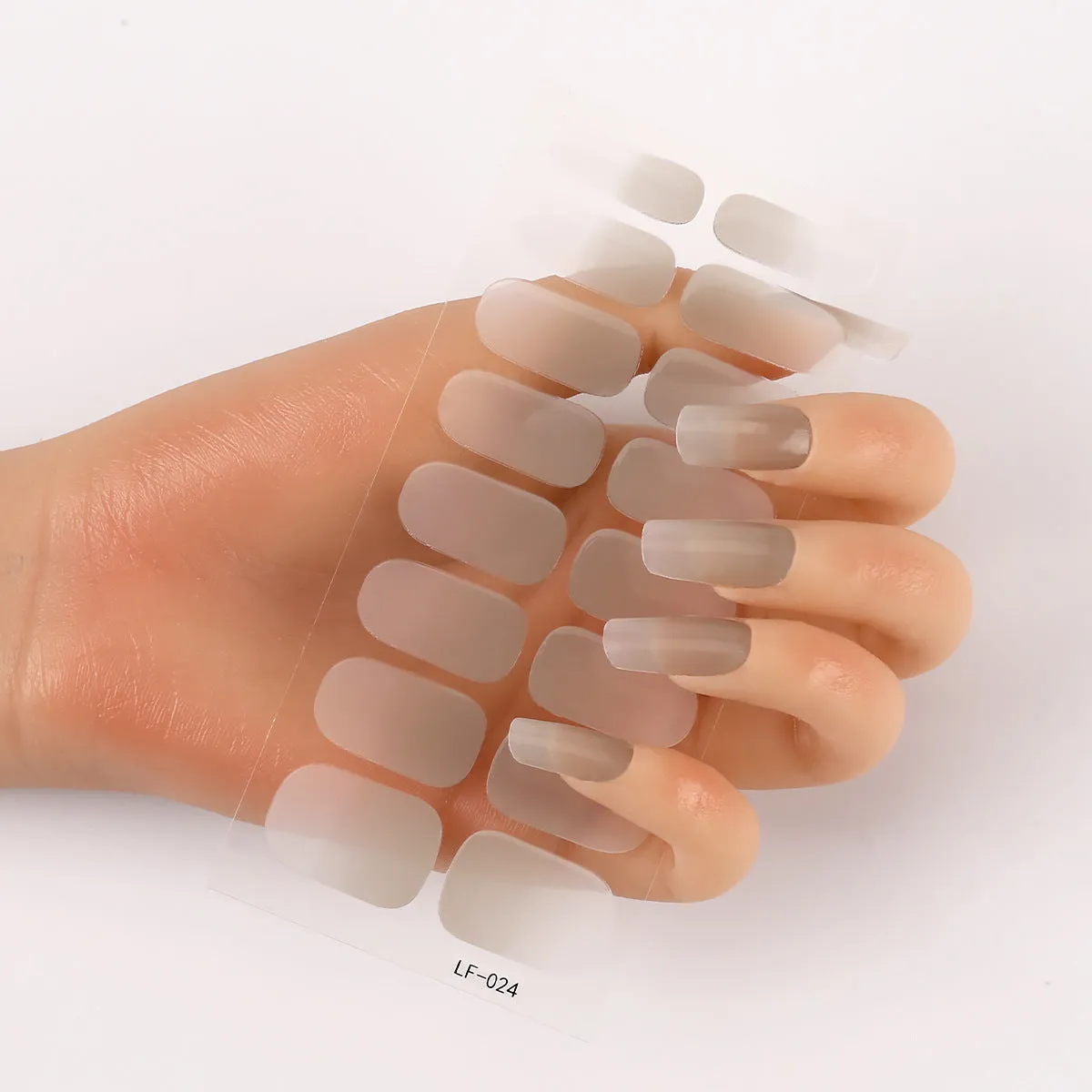 Pack of solid colour nail art stickers showing 16 different small designs including flowers, animals, and geometric patterns.