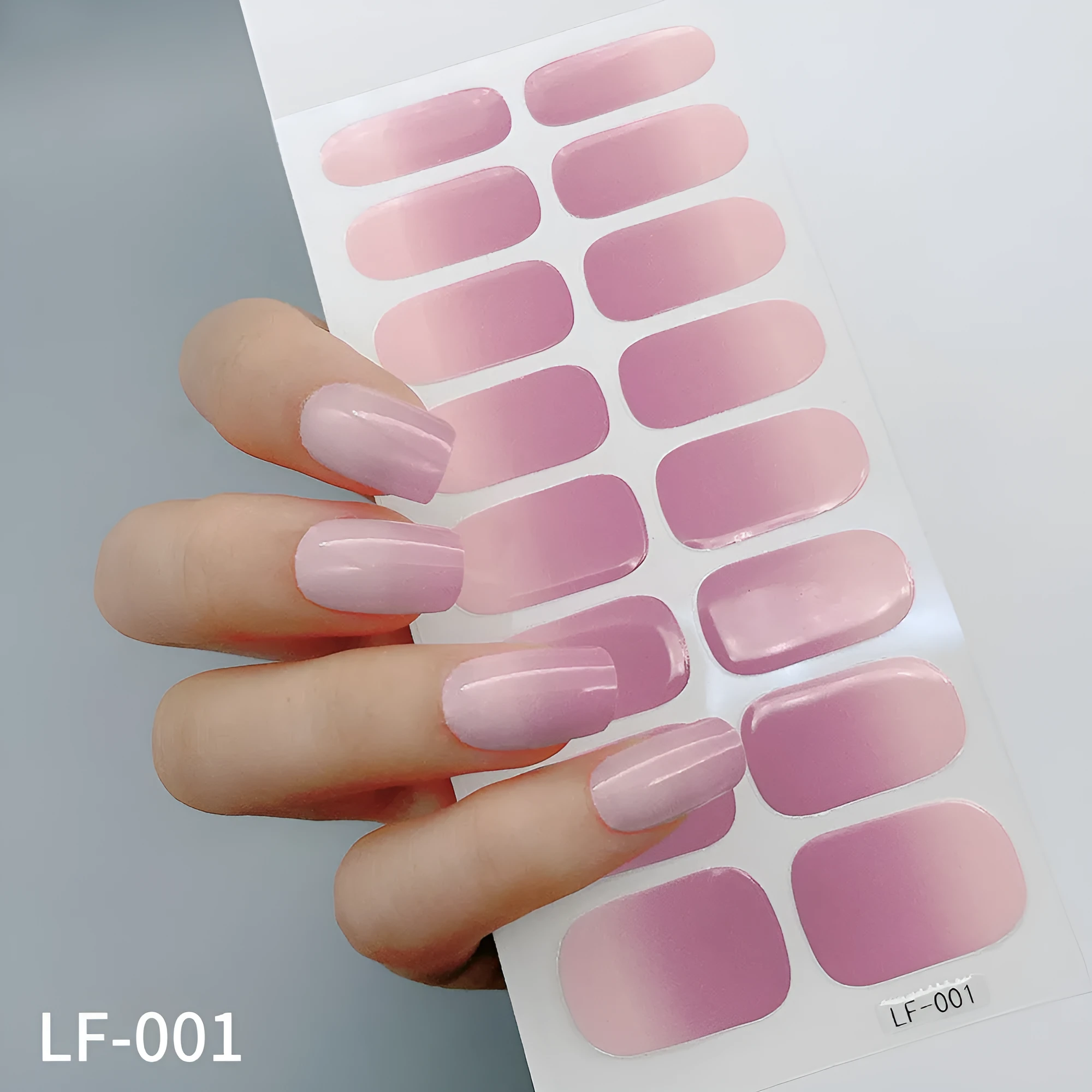 Pack of solid colour nail art stickers showing 16 different small designs including flowers, animals, and geometric patterns.