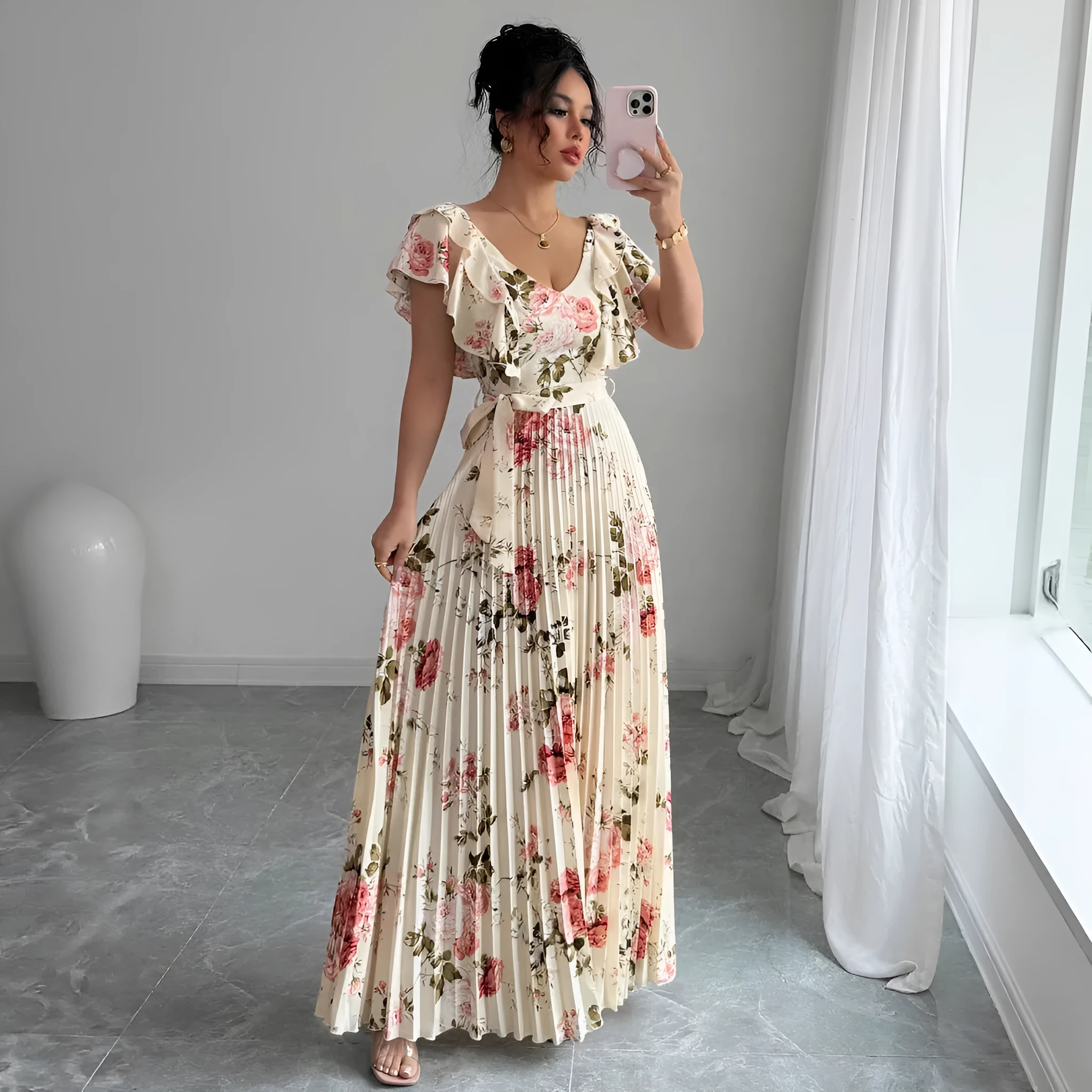 Apricot floral print women's dress with v-neck, ruffled sleeves, and a high-waisted long swing skirt.