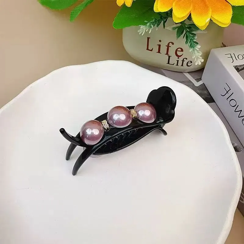 Acrylic pea barrette hair clip for women in green, shown against a dark background
