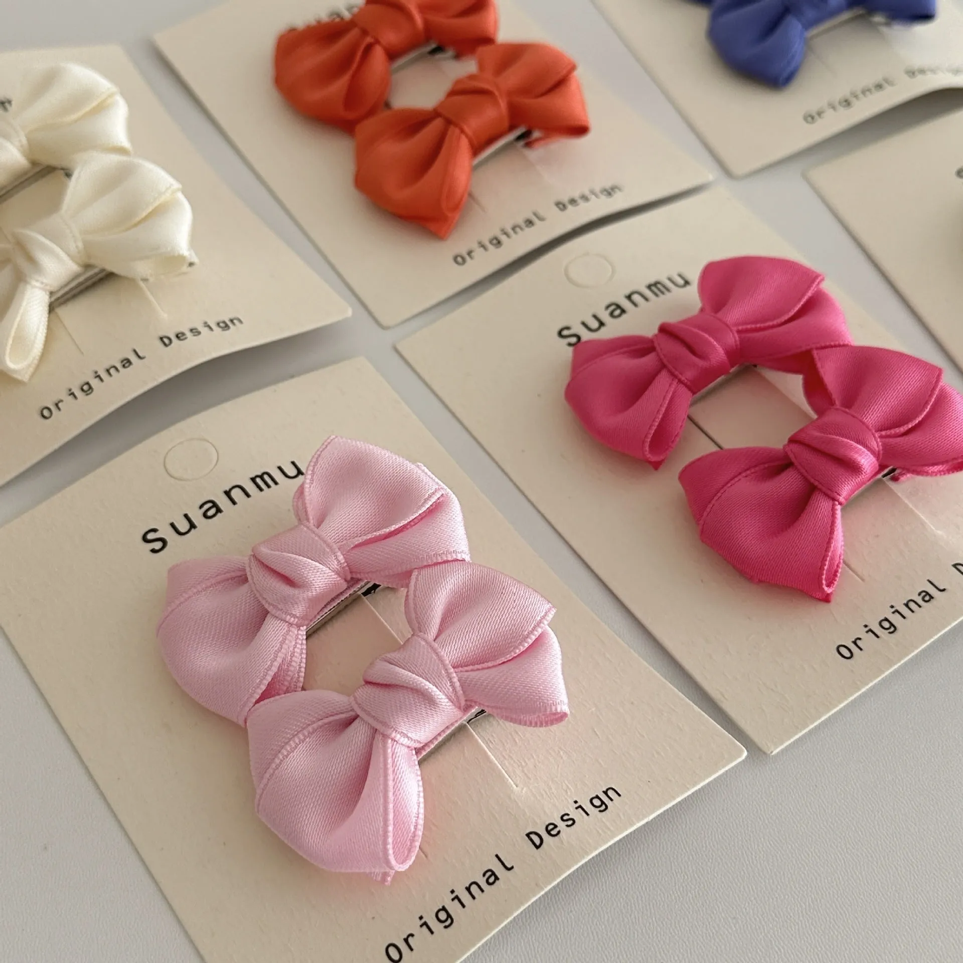 Fabric bowknot children's hair clip in cream colour with 6cm bow size on side clip