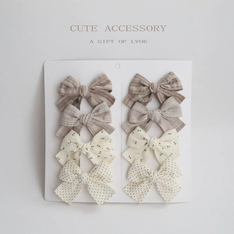 Dovetail bow hairclip set for children in cloth material with eight colour options
