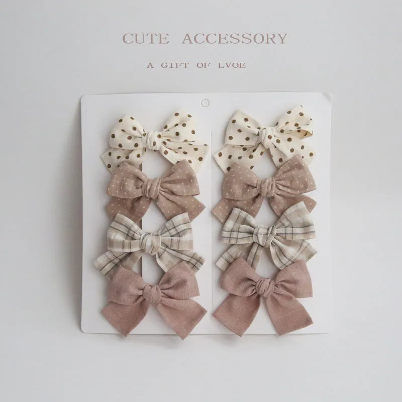Dovetail bow hairclip set for children in cloth material with eight colour options