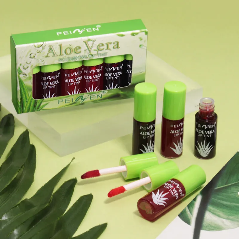 Set of six aloe lip gloss tubes in different colours on a light background