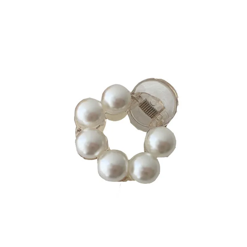 Women's pearl hair barrette in big pearl colour, manual finish, front view