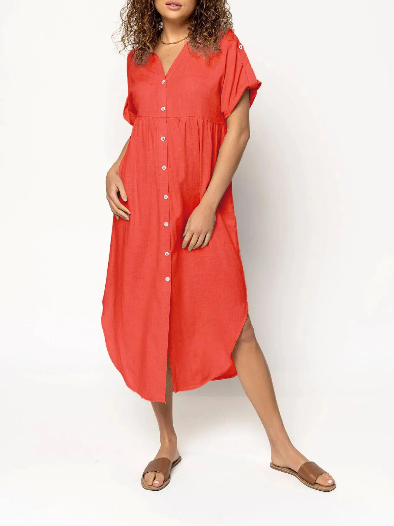 Loose-fitting casual midi dress with buttons down the front, shown in a solid colour.