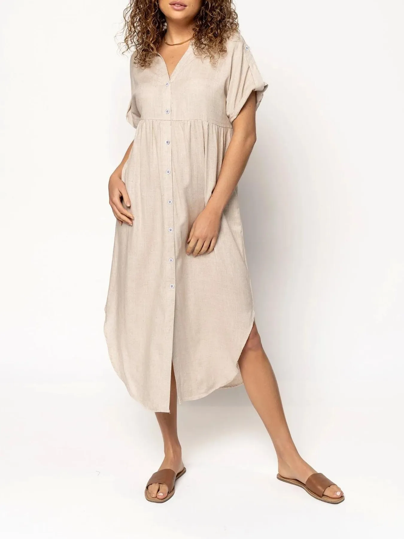 Loose-fitting casual midi dress with buttons down the front, shown in a solid colour.