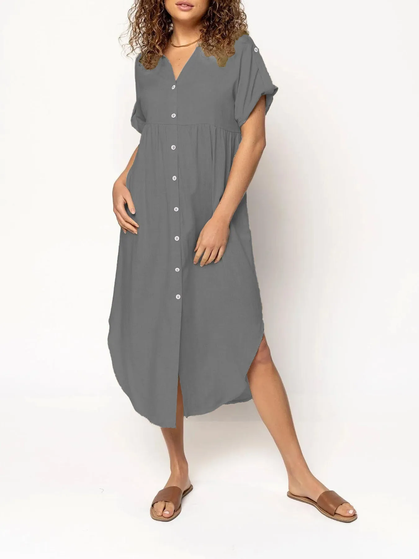 Loose-fitting casual midi dress with buttons down the front, shown in a solid colour.