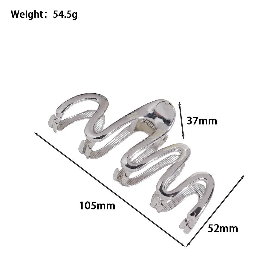 Assortment of silver metal hair barrettes and claw clips in various Korean-style designs on a white background.