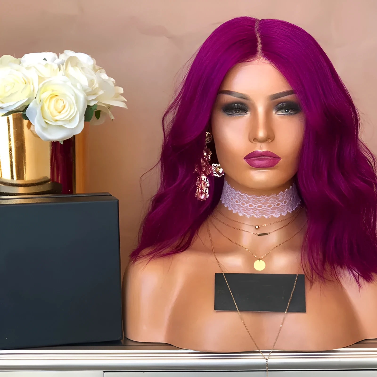 Women's medium to long curled hair wig in rose red with big wave curls, 45cm length, on display