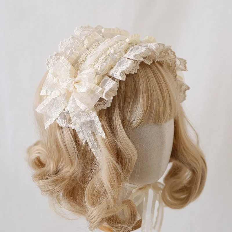 Children's hair band with bow lace detailing in light pink and white lace colour option.