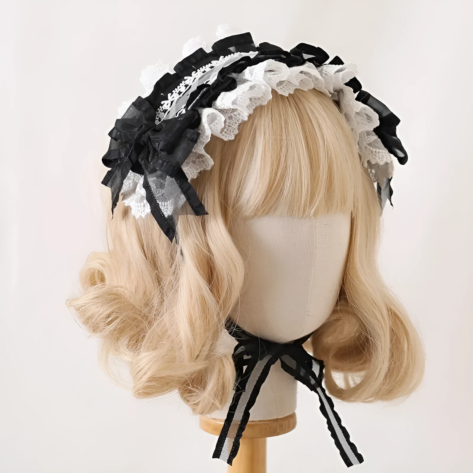 Children's hair band with bow lace detailing in light pink and white lace colour option.