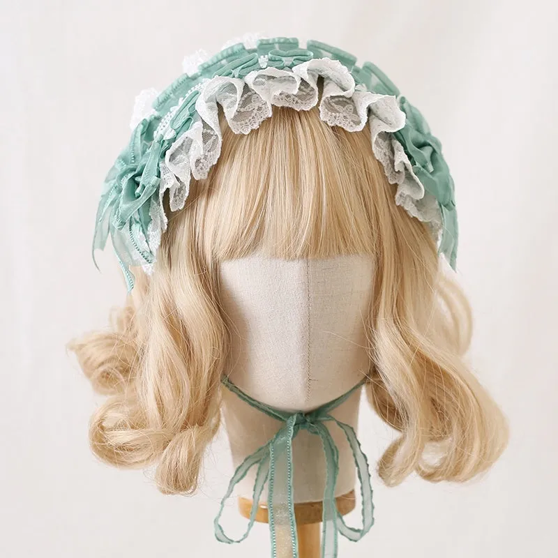 Children's hair band with bow lace detailing in light pink and white lace colour option.