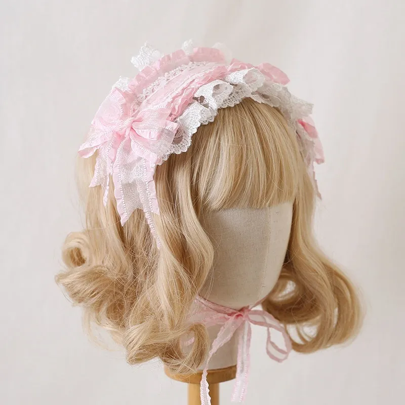 Children's hair band with bow lace detailing in light pink and white lace colour option.