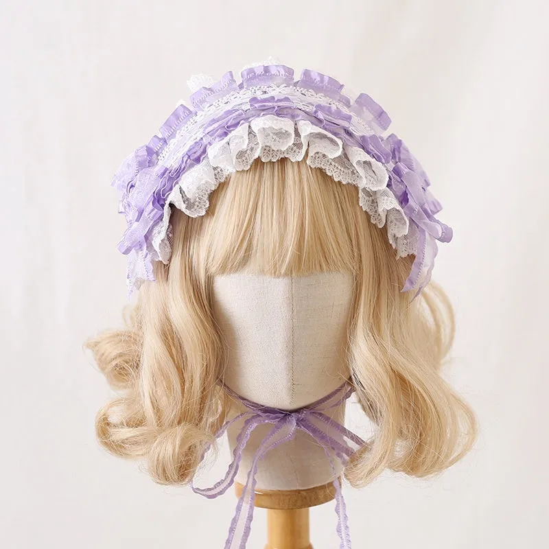 Children's hair band with bow lace detailing in light pink and white lace colour option.